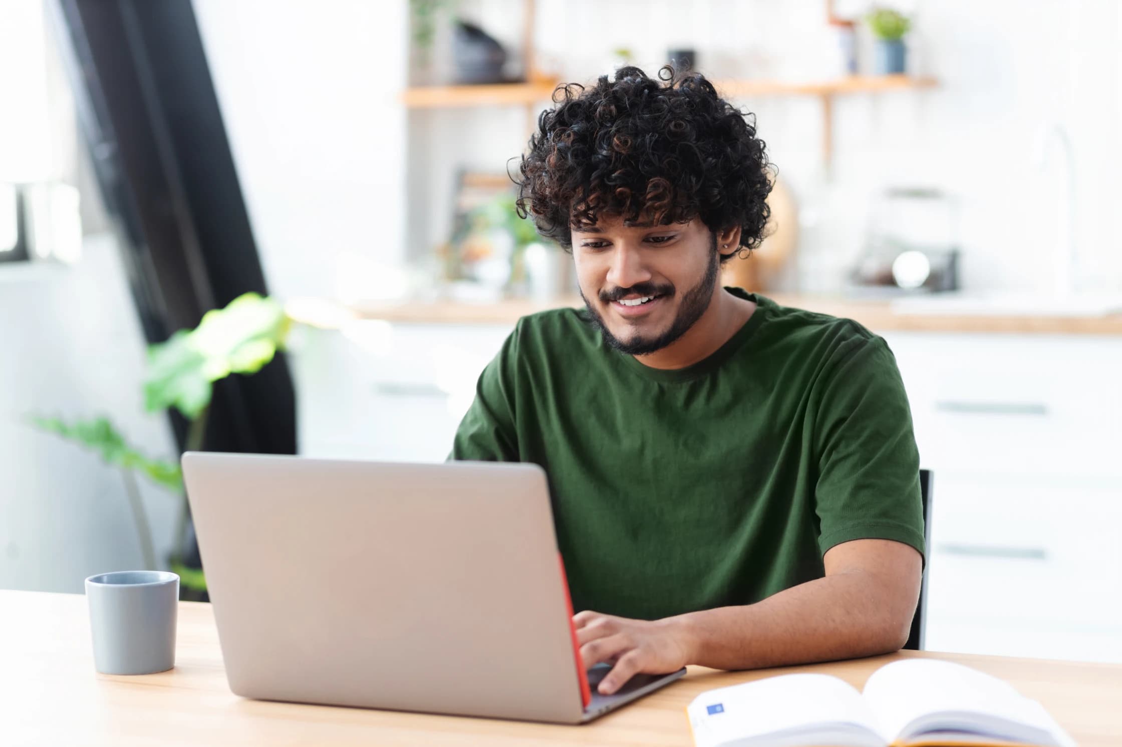 Man using laptop to look for work