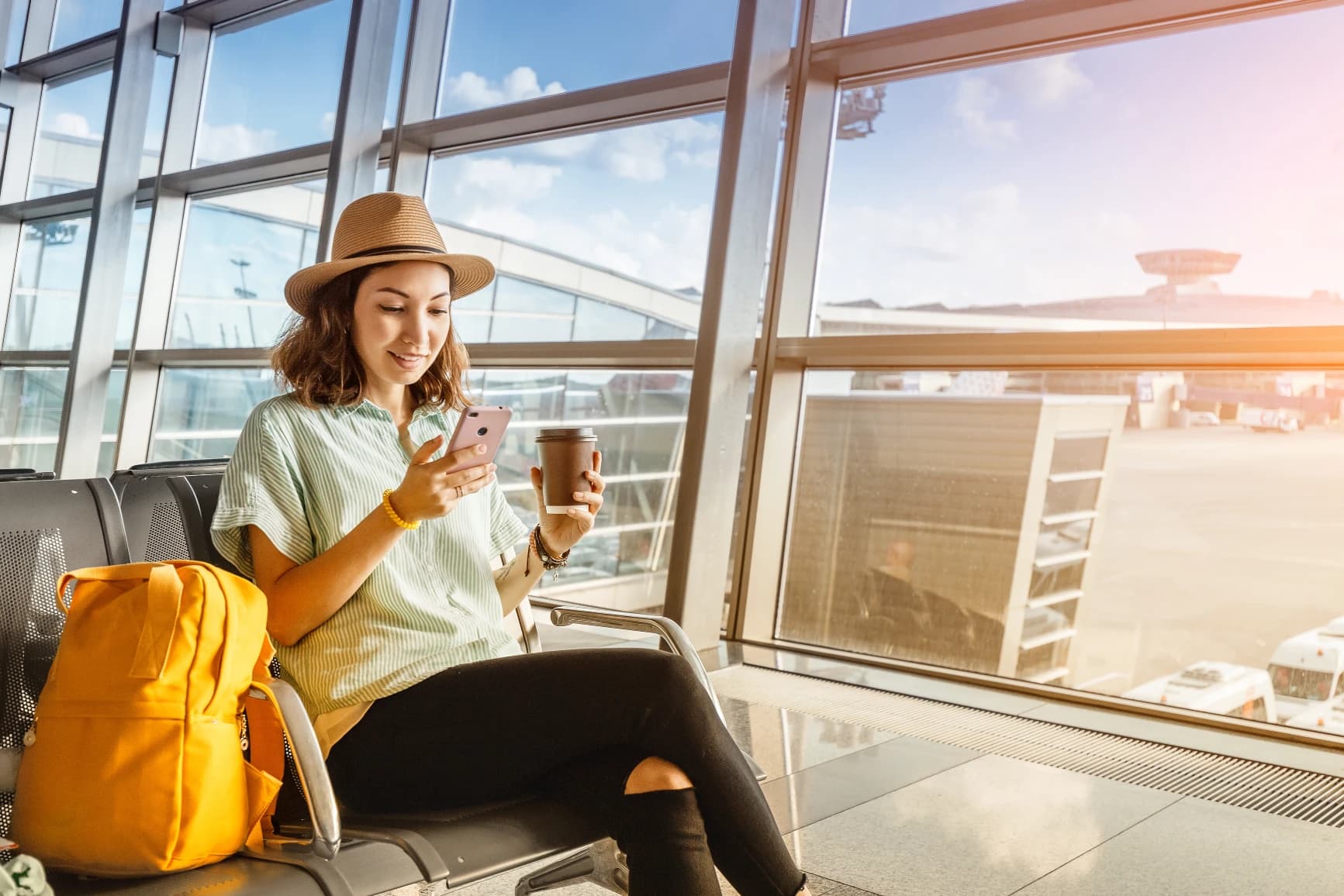 Woman waiting for departure at the airport on vacation