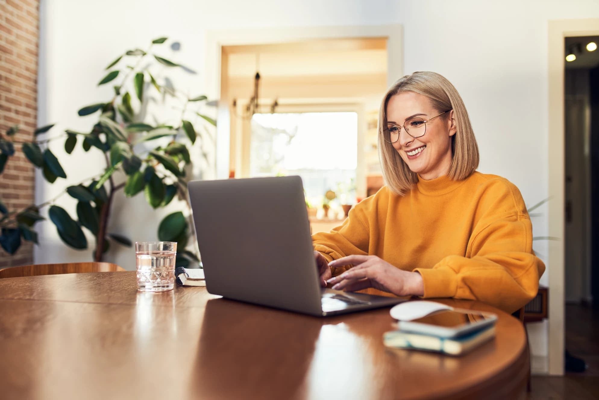 Woman using laptop at home