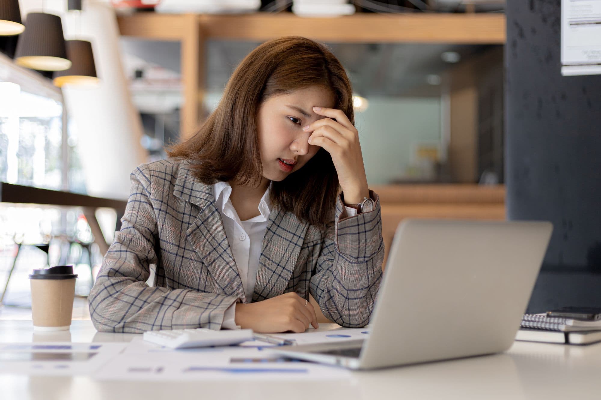 person-at-laptop-managing-finances