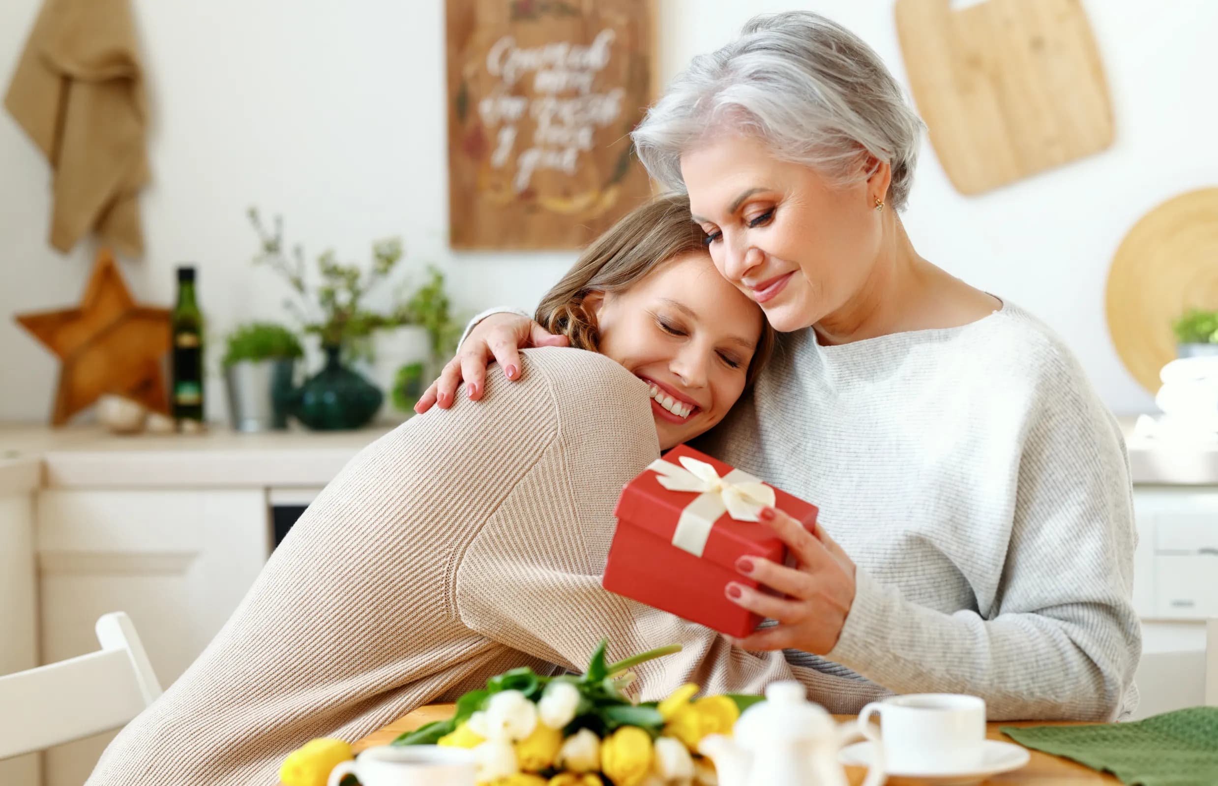 mother-and-daughter-laughing-together-over-brunch-at-a-canadian-restaurant-on-mothers-day