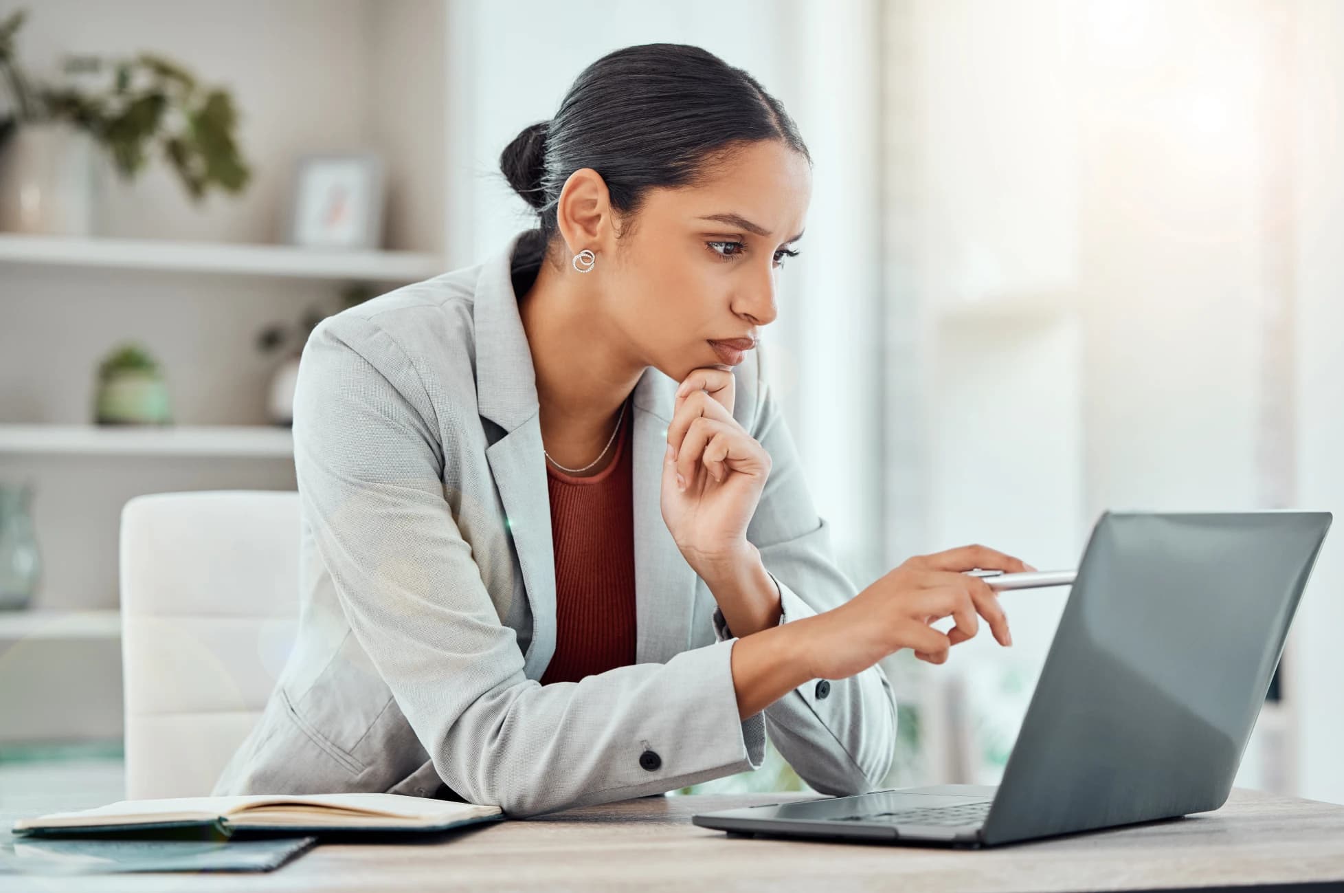 Person-reviewing-payday-loan-terms-and-regulations-on-a-laptop-highlighting-borrower-rights-and-protections-in-Ontario