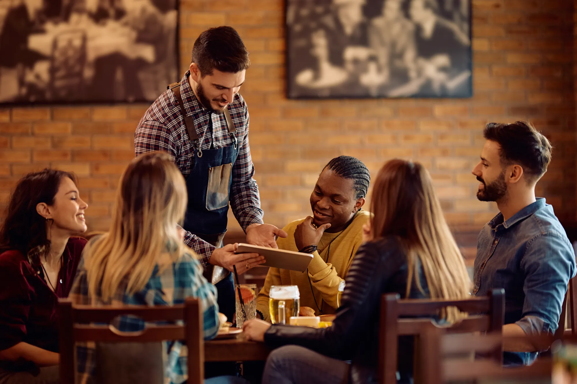 ontario-minimum-wage-worker-waiter-serving-customers-at-table