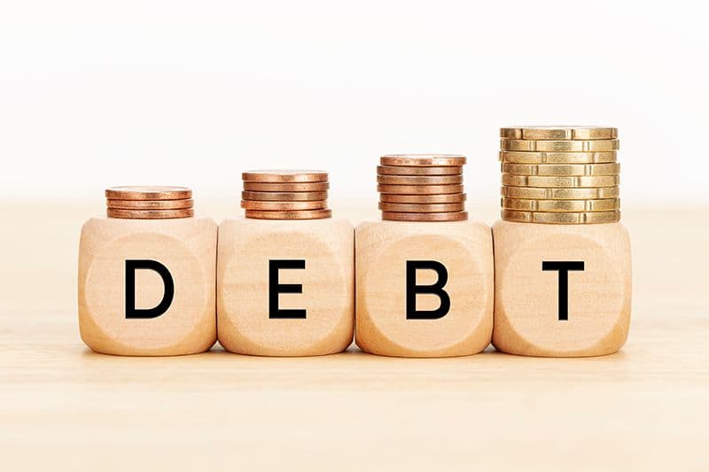 debt-concept-wooden-blocks-with-text-and-coins